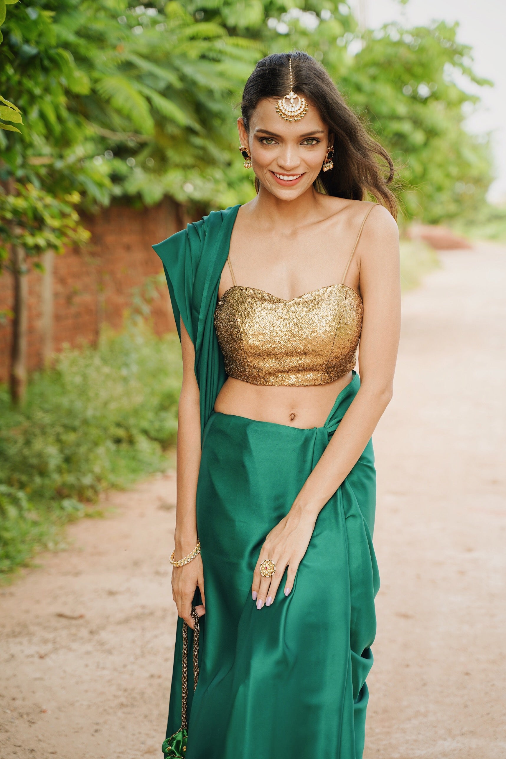 Rich Emerald Green Satin Saree with Bronze Pendants