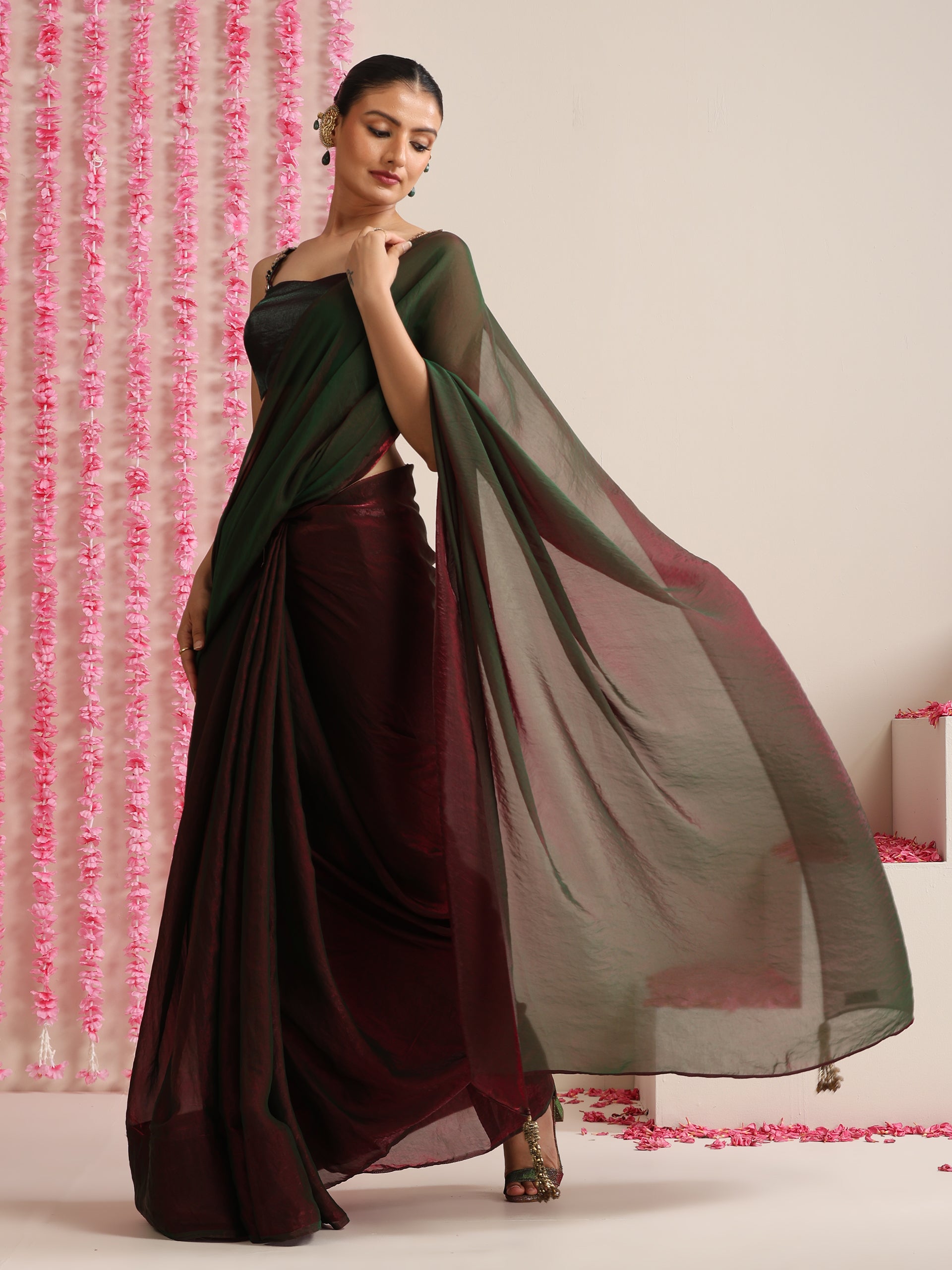 Enigmatic Elegance Saree – Dual-Shade Maroon-Green Metallic Satin with Pendants & Self Blouse Fabric