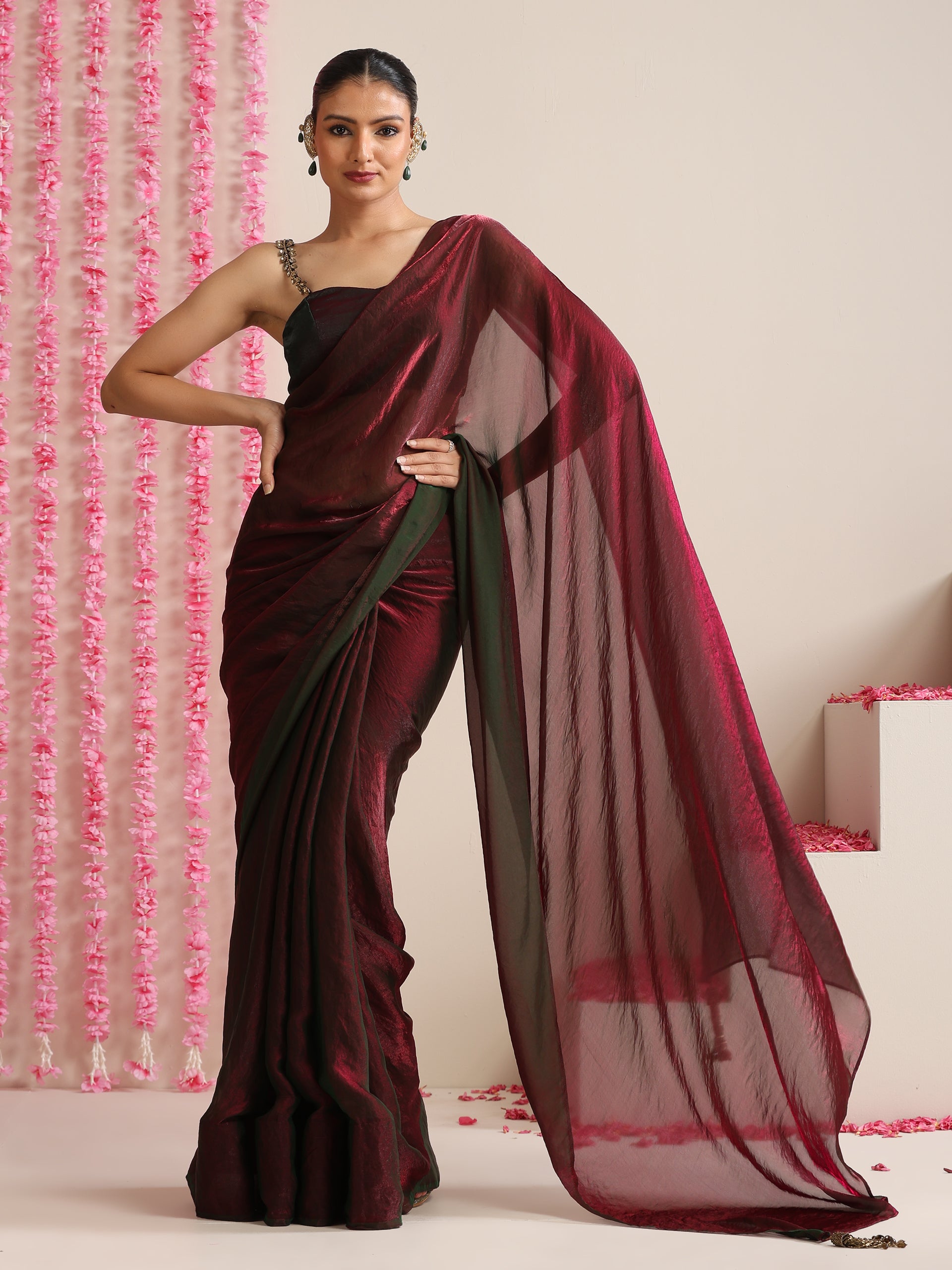 Enigmatic Elegance Saree – Dual-Shade Maroon-Green Metallic Satin with Pendants & Self Blouse Fabric