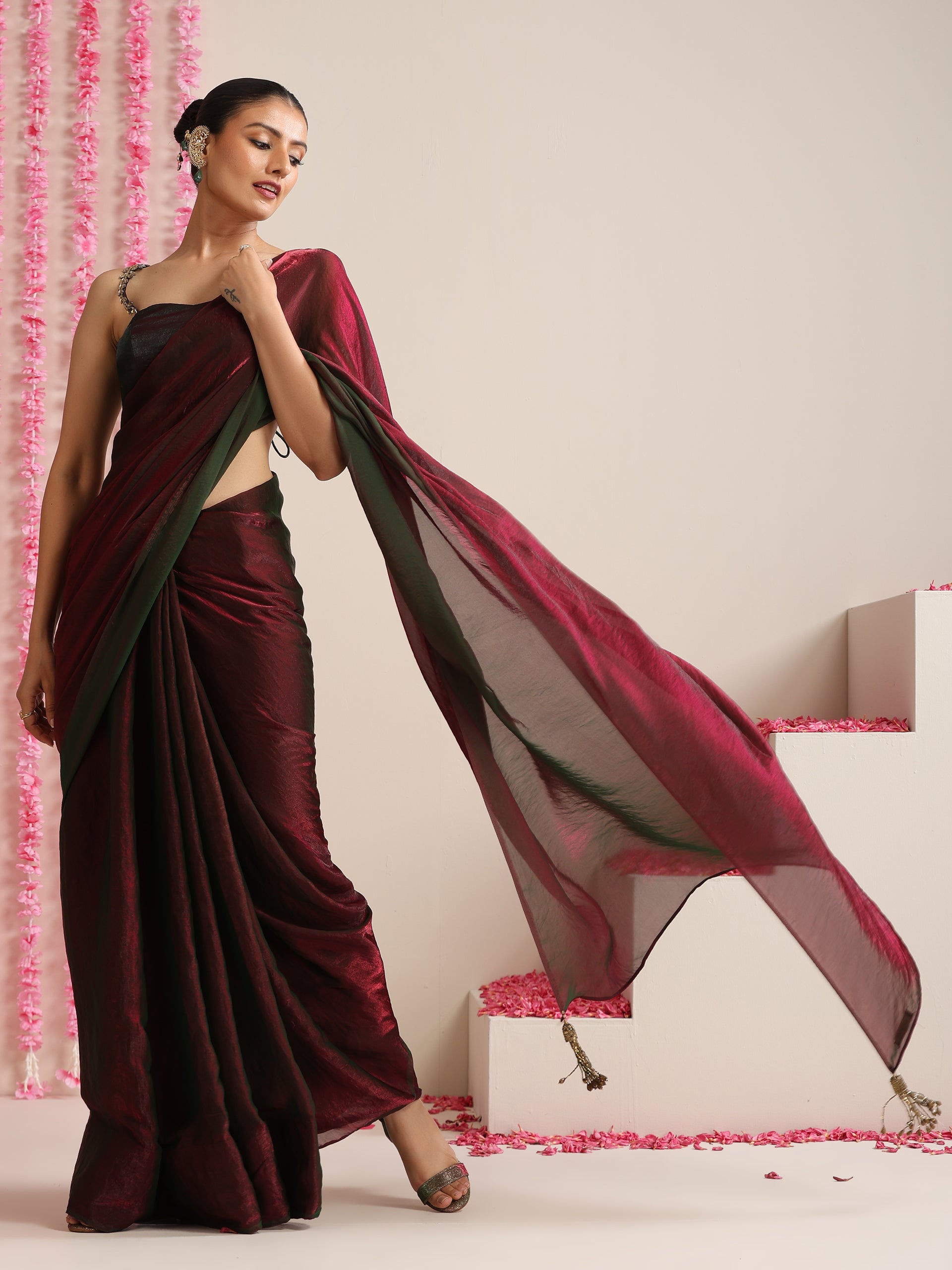 Enigmatic Elegance Saree – Dual-Shade Maroon-Green Metallic Satin with Pendants & Self Blouse Fabric