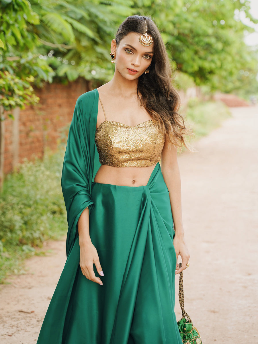 Rich Emerald Green Satin Saree with Bronze Pendants – Swtantra