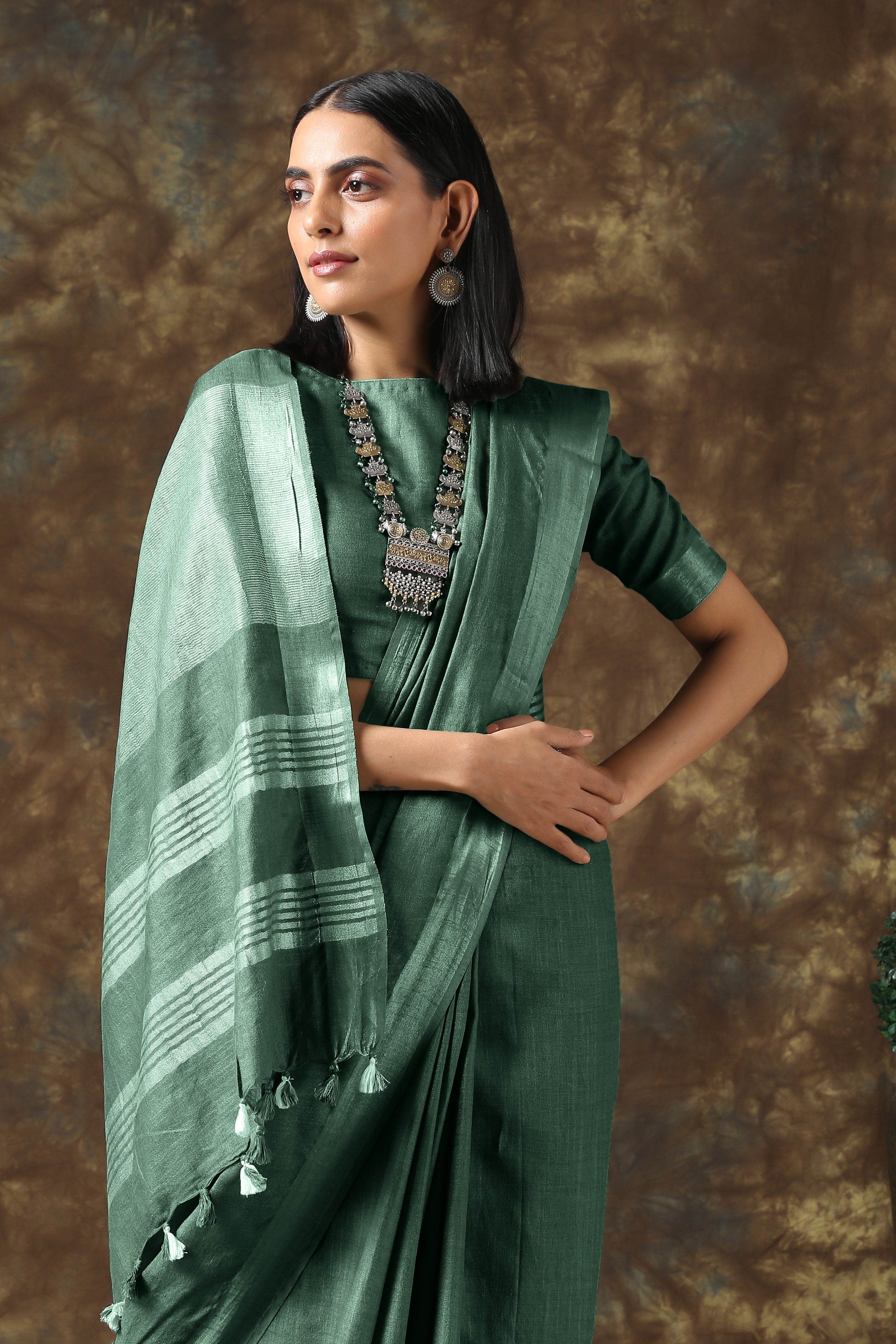 Opulent olive linen saree with silver border and blouse — view 3