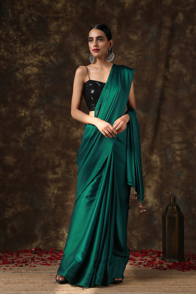 Rich Emerald Green Satin Saree with Bronze Pendants – Swtantra