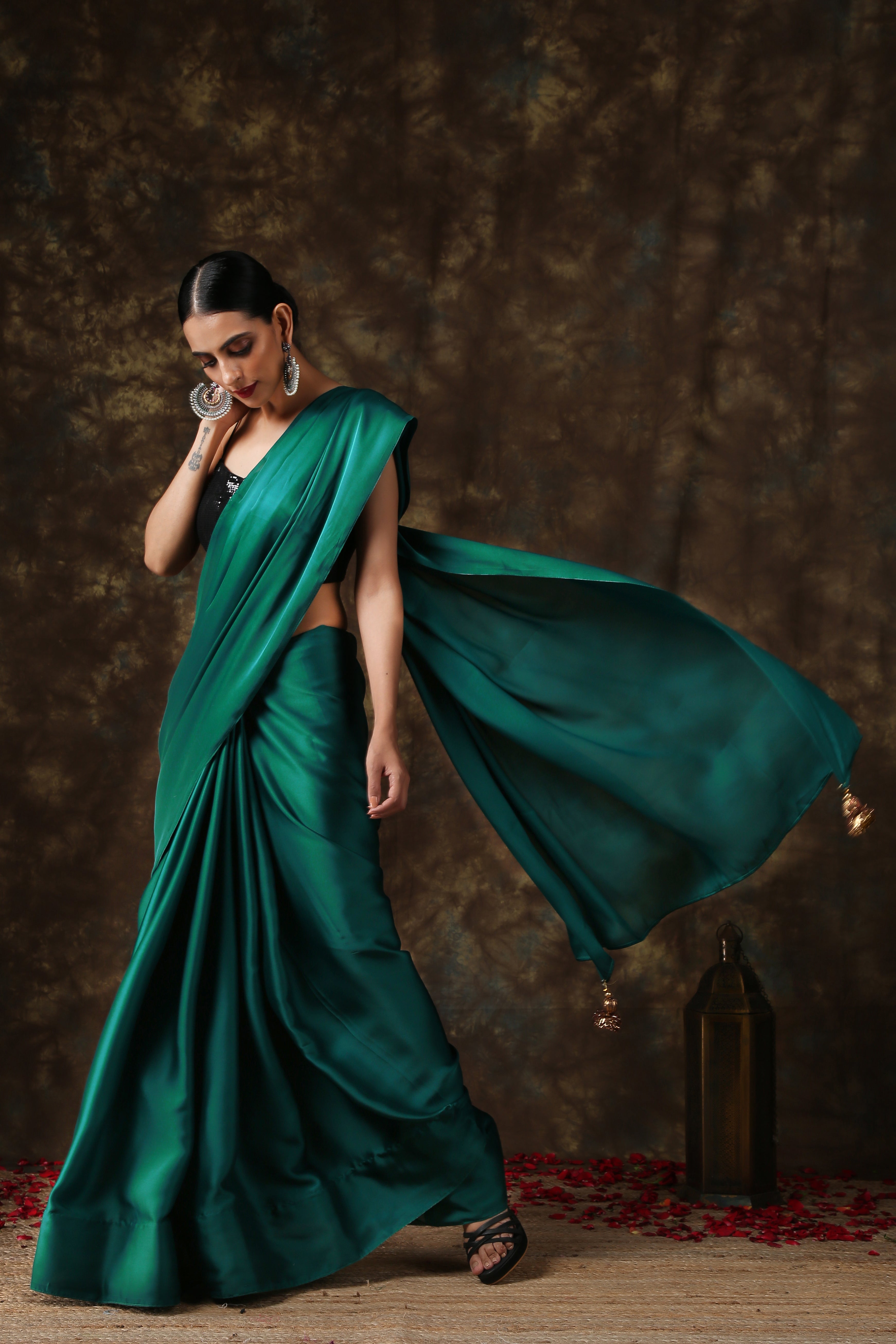 Rich Emerald Green Satin Saree with Bronze Pendants