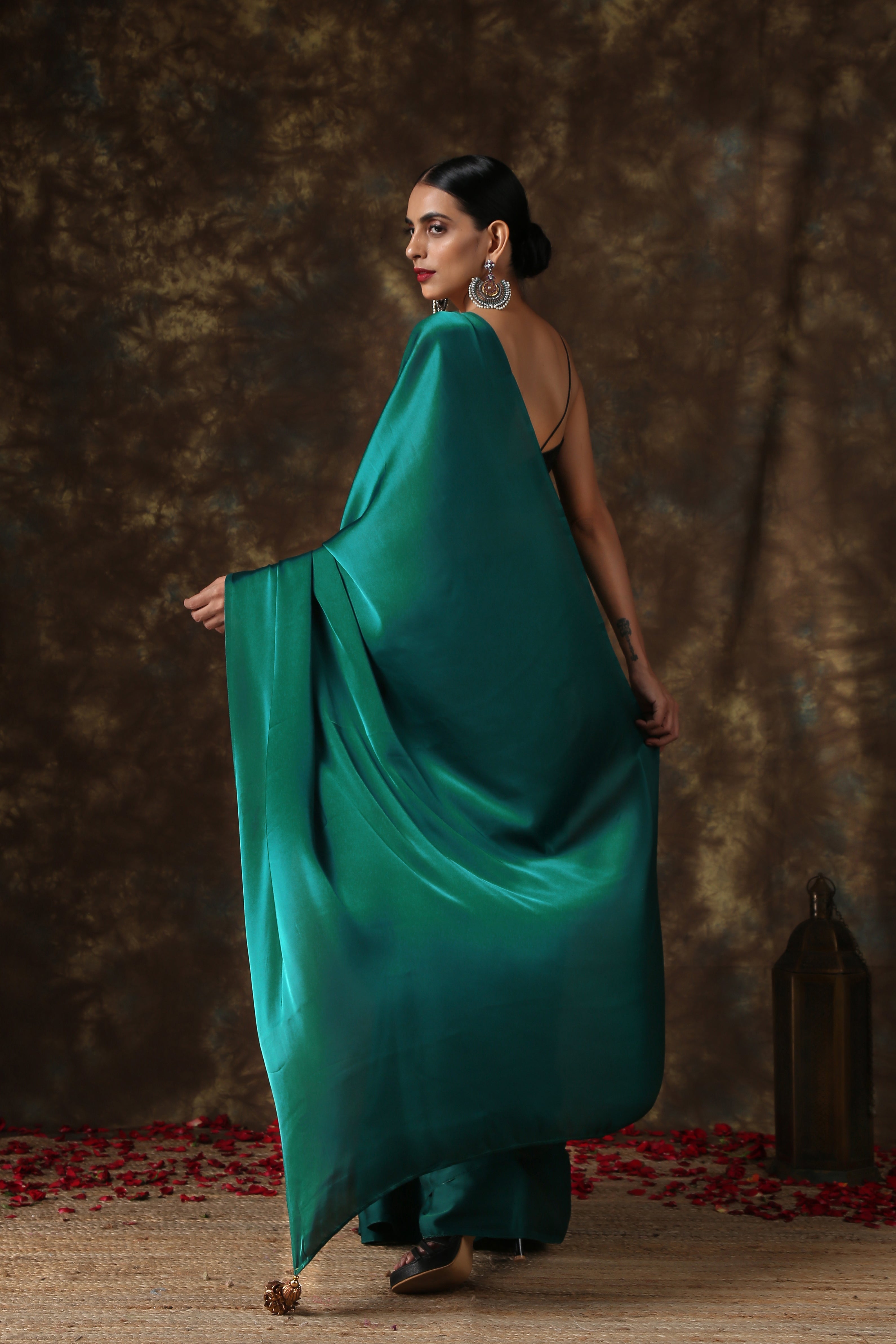 Rich Emerald Green Satin Saree with Bronze Pendants