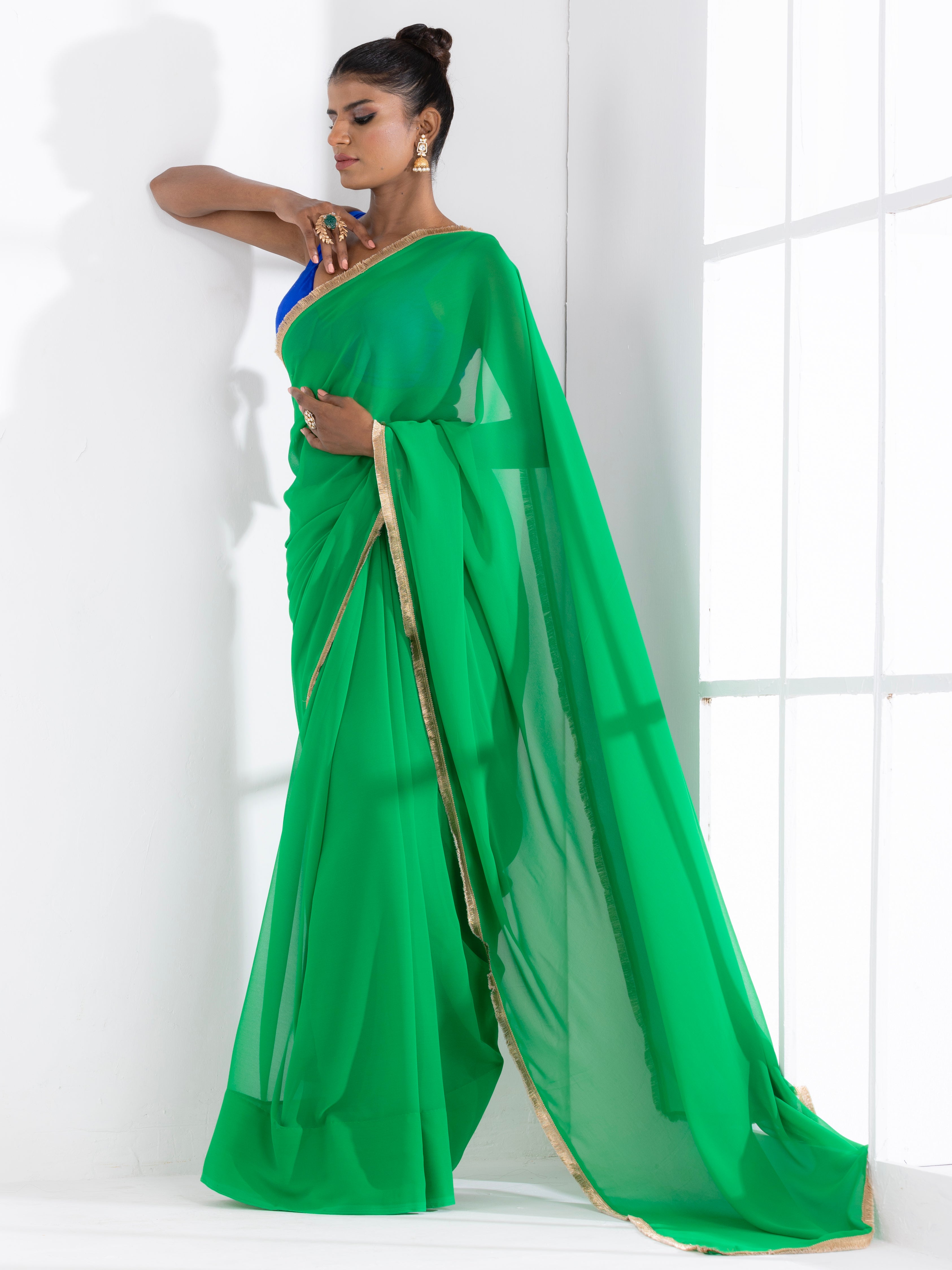 Irish Green Georgette Saree with Lace and Blue Posh Blouse Fabric