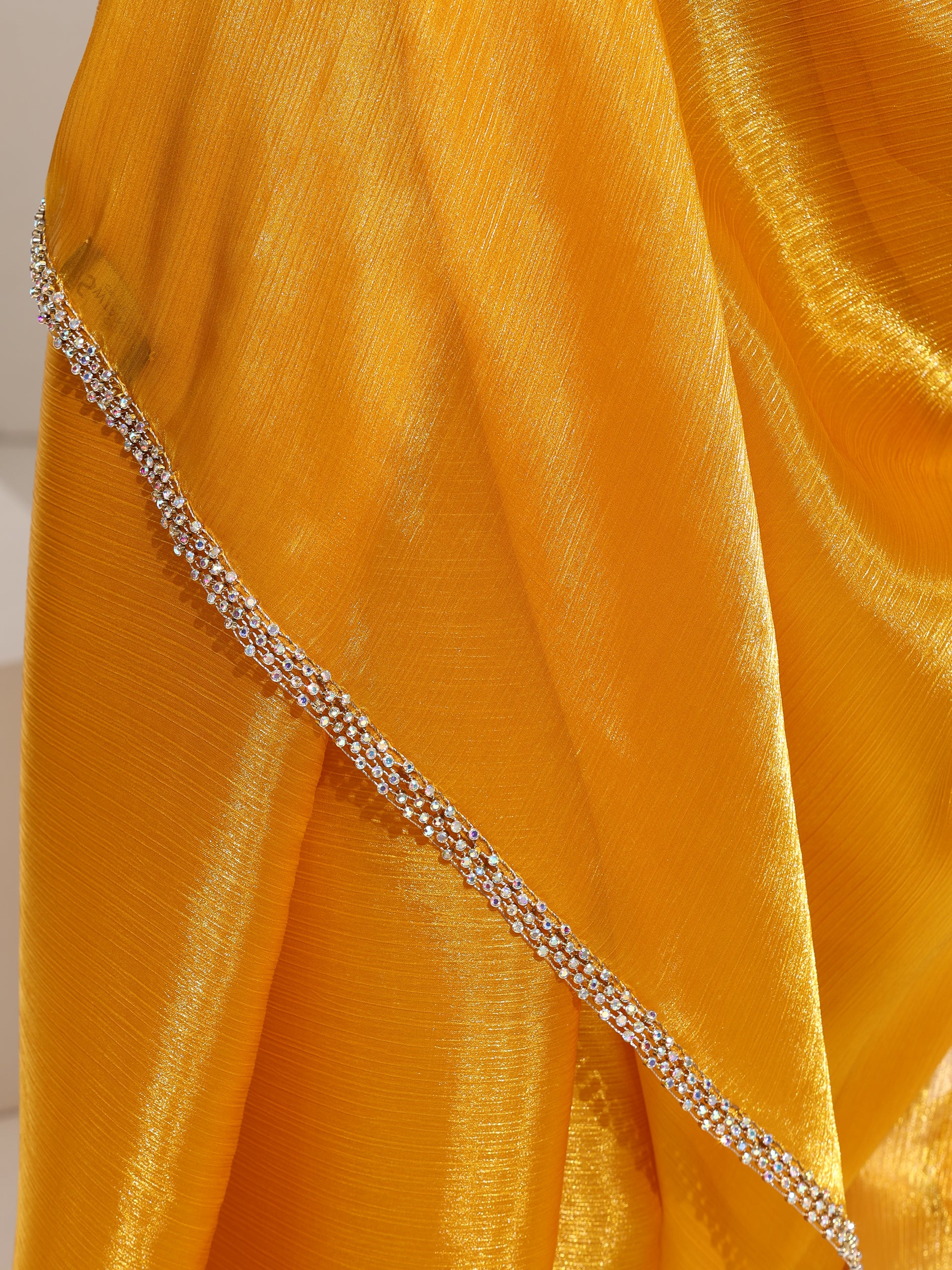 Sizzlin Saffron Organza Chiffon saree with Rainbow Stone Lace and Self Blouse Fabric