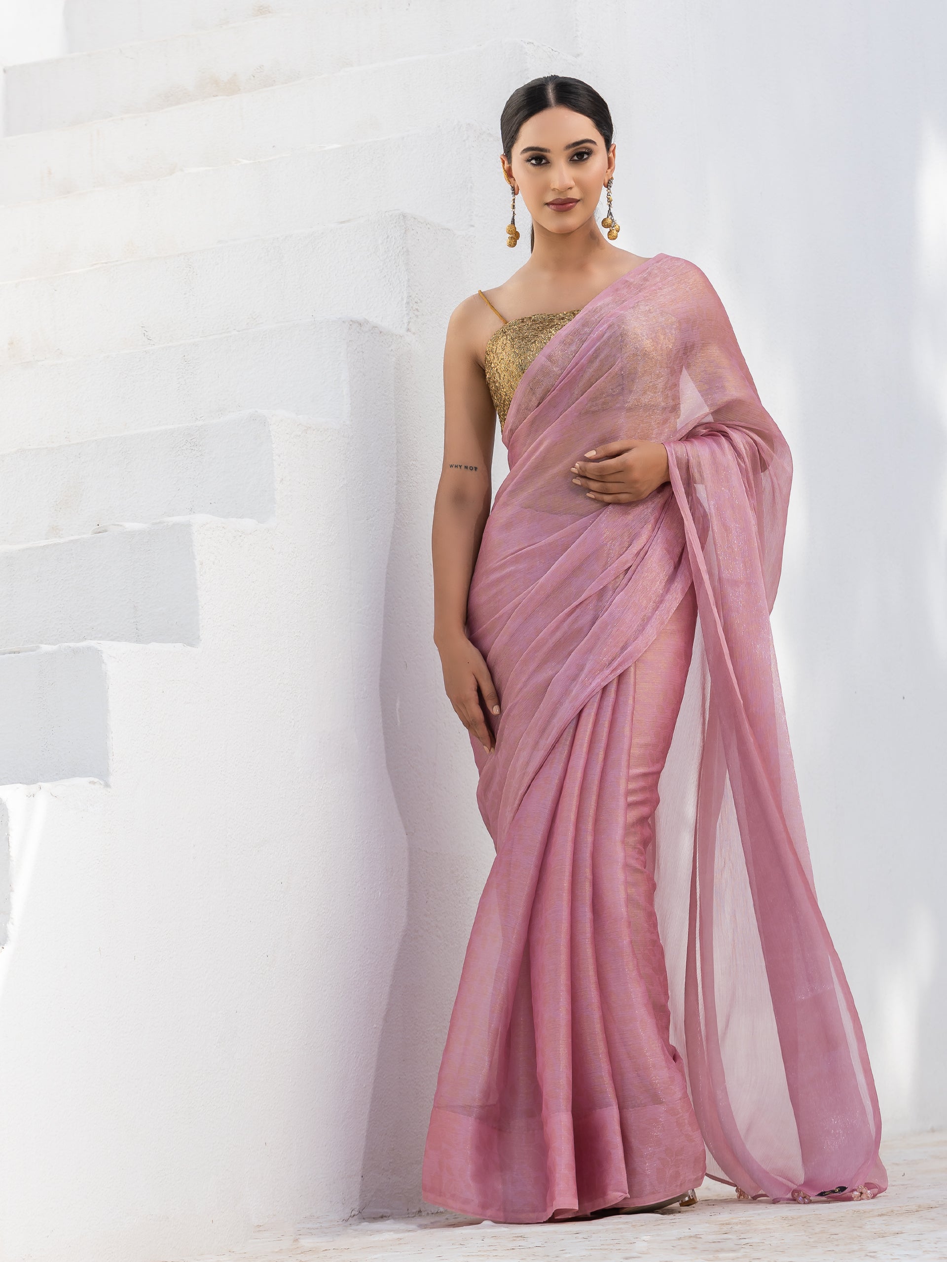 Pink with golden floral printed chiffon saree with pendants