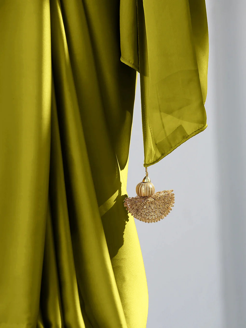 Lime satin saree with gold flat pendants — view 3
