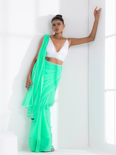 Summer Breeze Green Georgette Saree with Edge Lace and Irridecent Blouse Fabric
