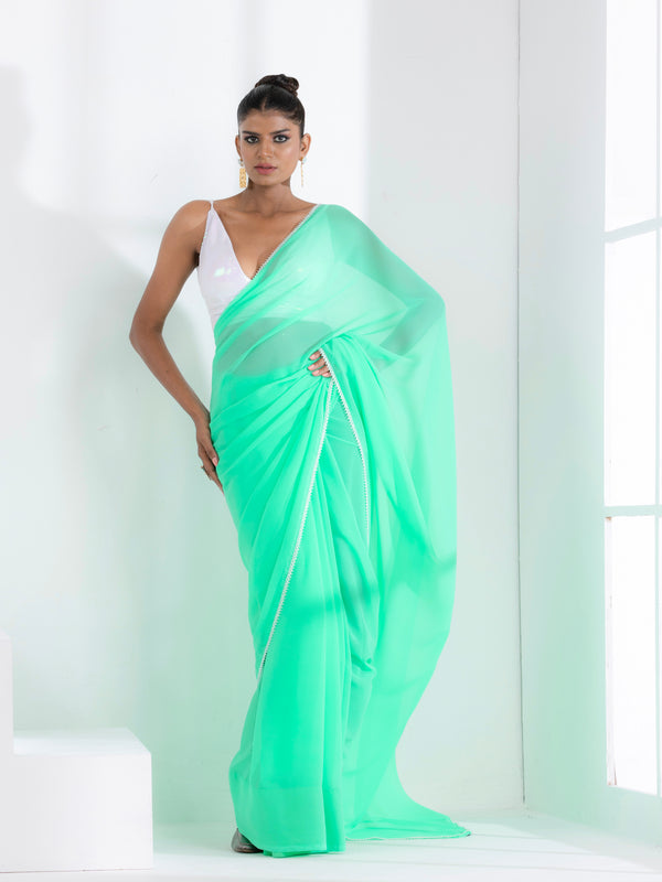 Summer Breeze Green Georgette Saree with Edge Lace and Irridecent Blouse Fabric