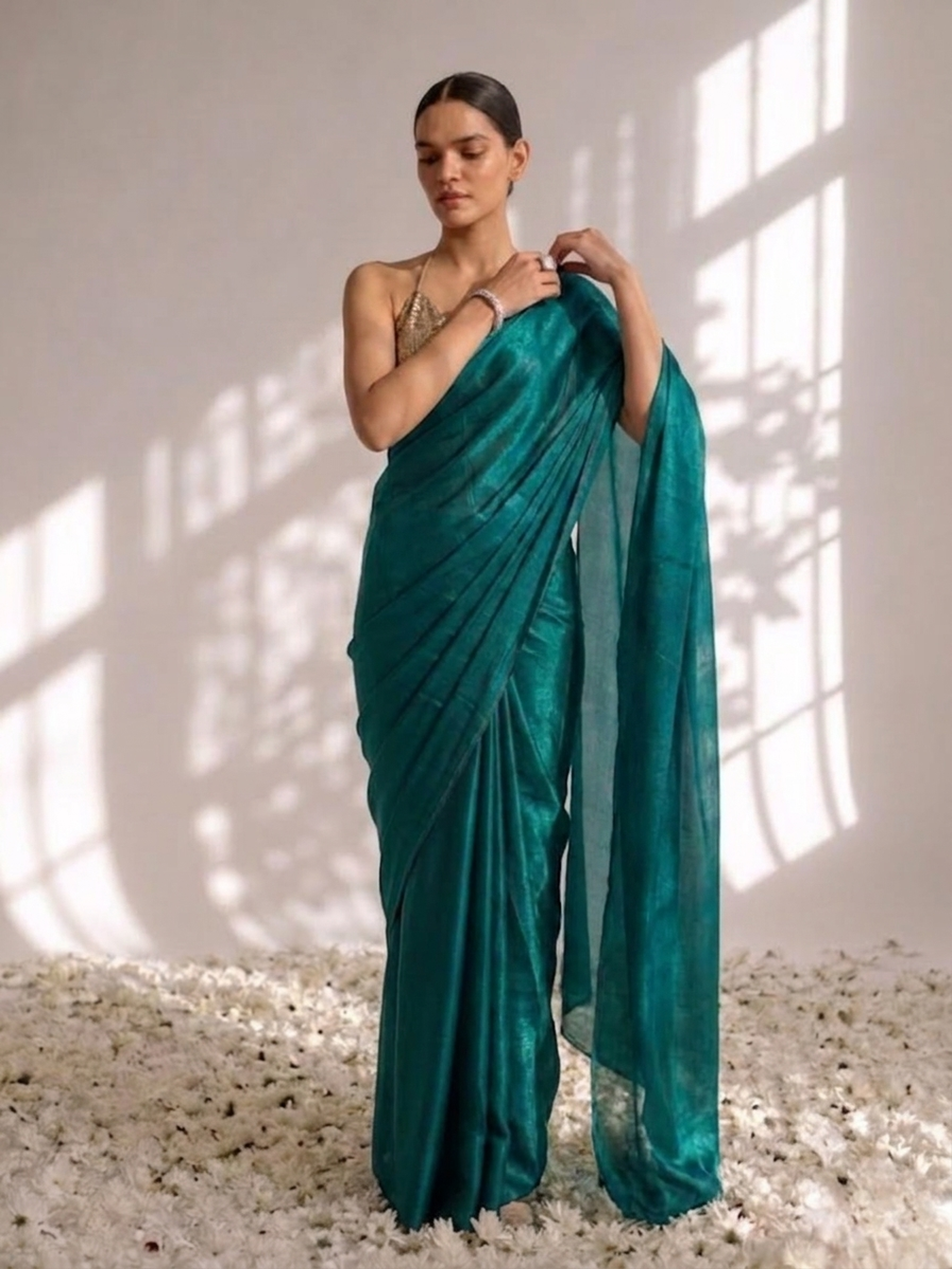 Green metallic satin saree with pendants and blouse fabric