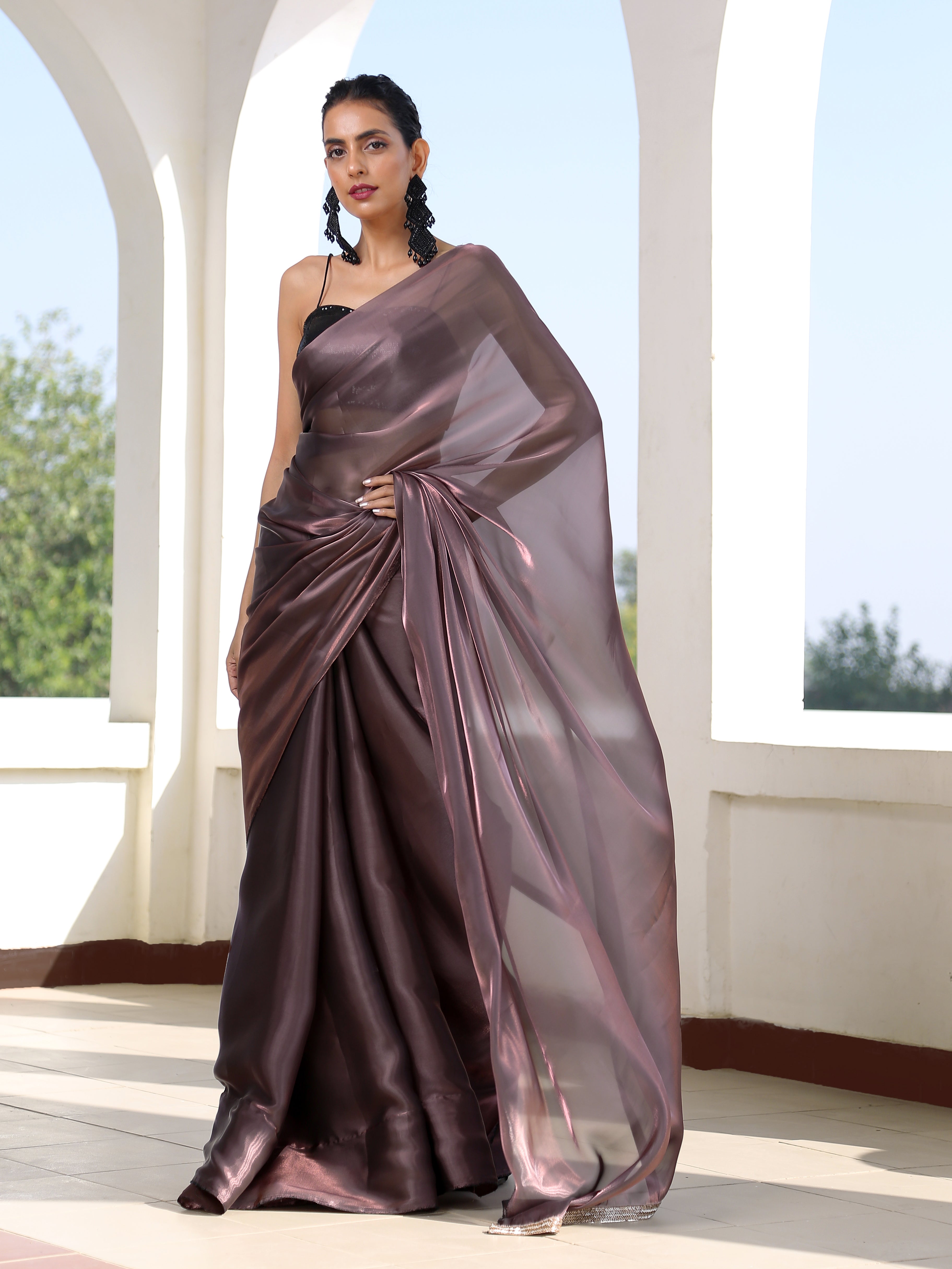 Rich Emerald Green Satin Saree with Bronze Pendants – Swtantra