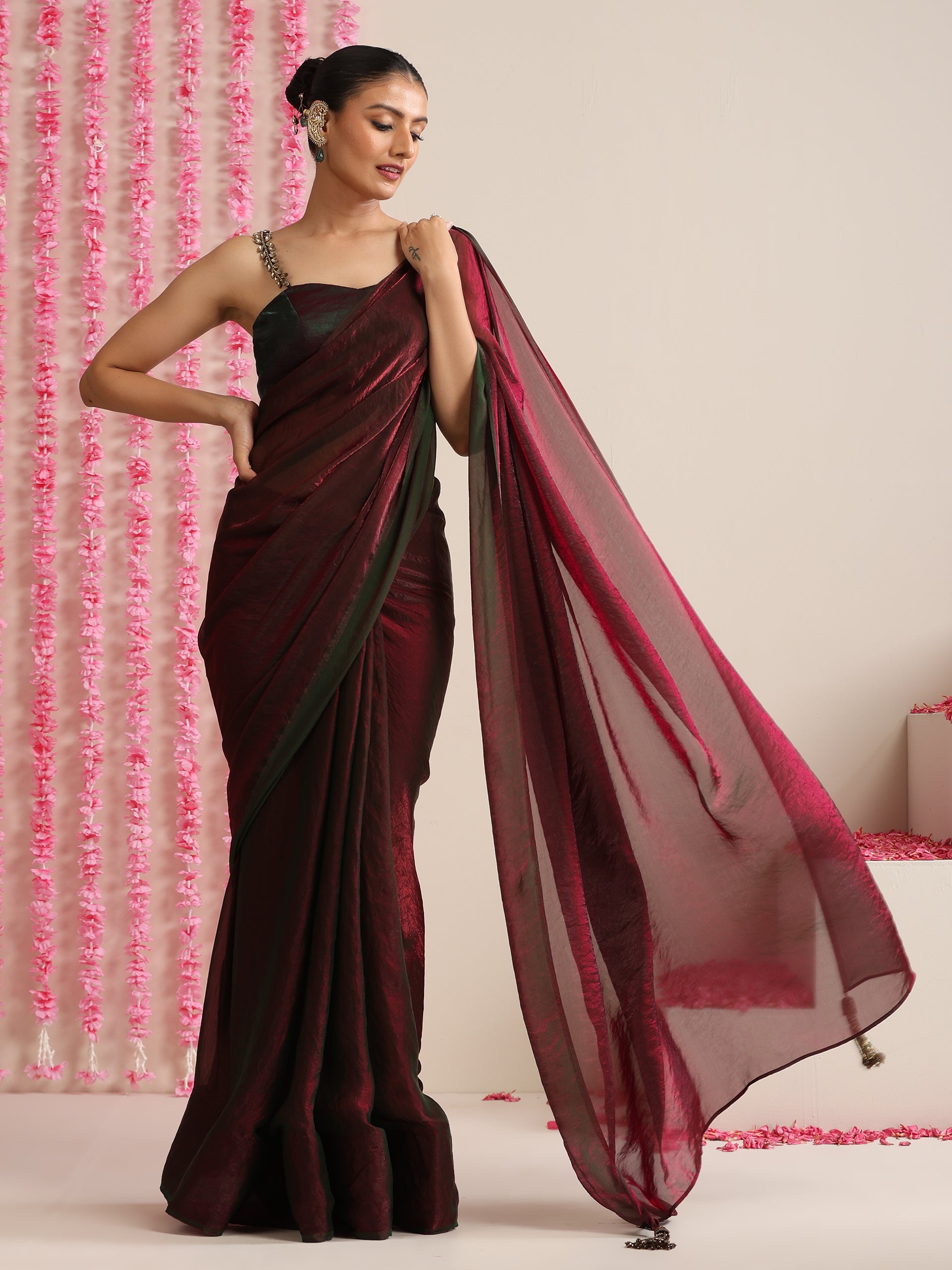 Enigmatic Elegance Saree – Dual-Shade Maroon-Green Metallic Satin with Pendants & Self Blouse Fabric