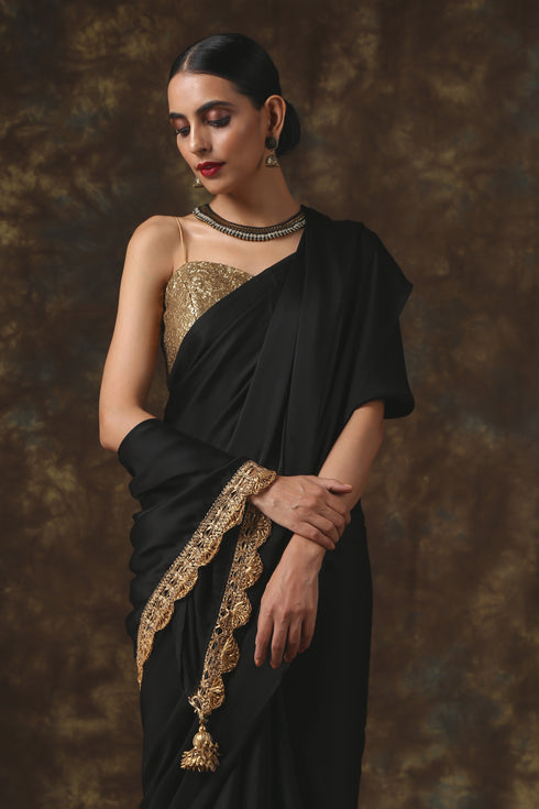 Luxurious Black Satin Saree with Dull Gold Lace and Pendants