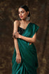 Rich Emerald Green Satin Saree with Bronze Pendants