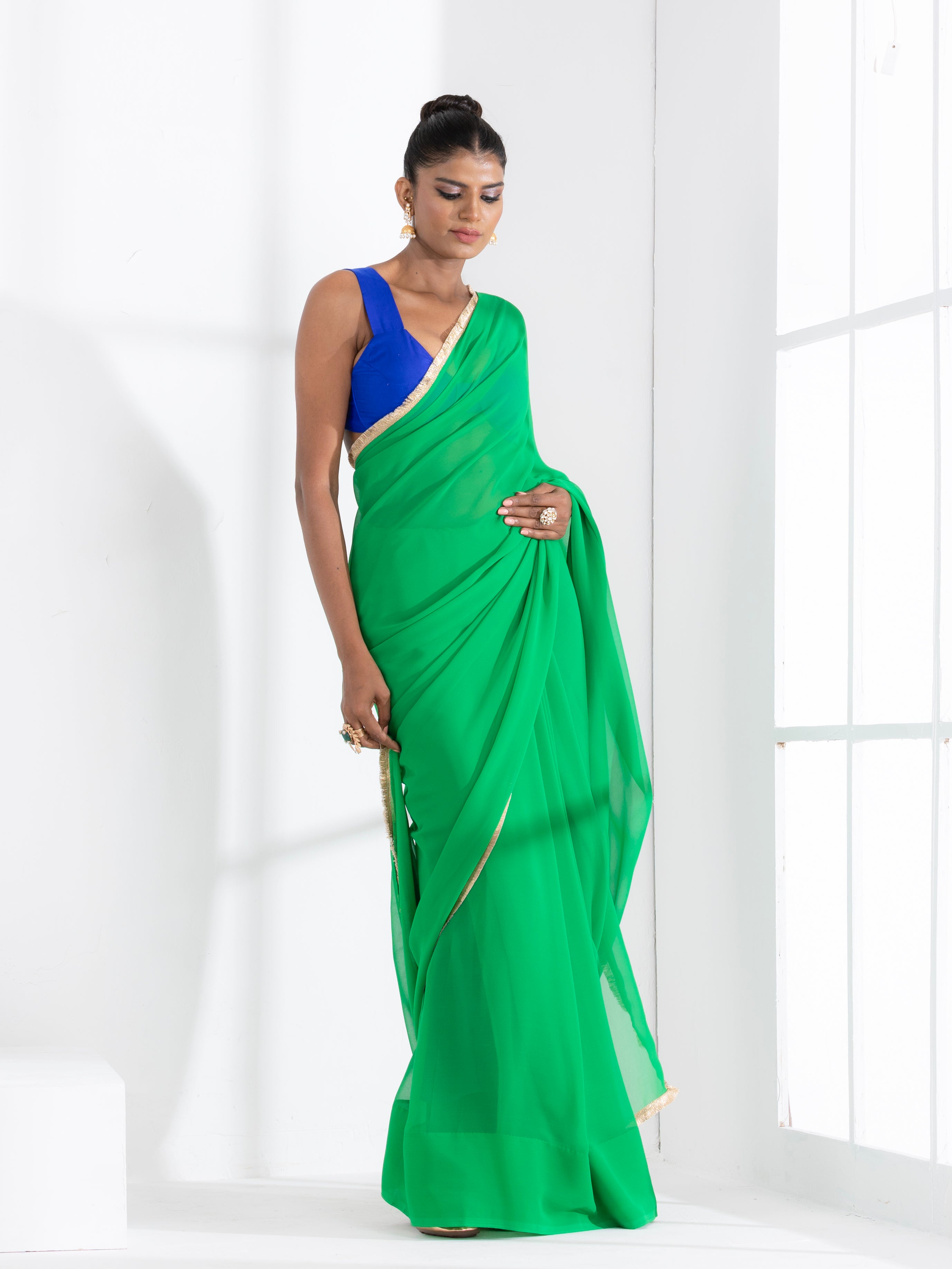Irish Green Georgette Saree with Lace and Blue Posh Blouse Fabric