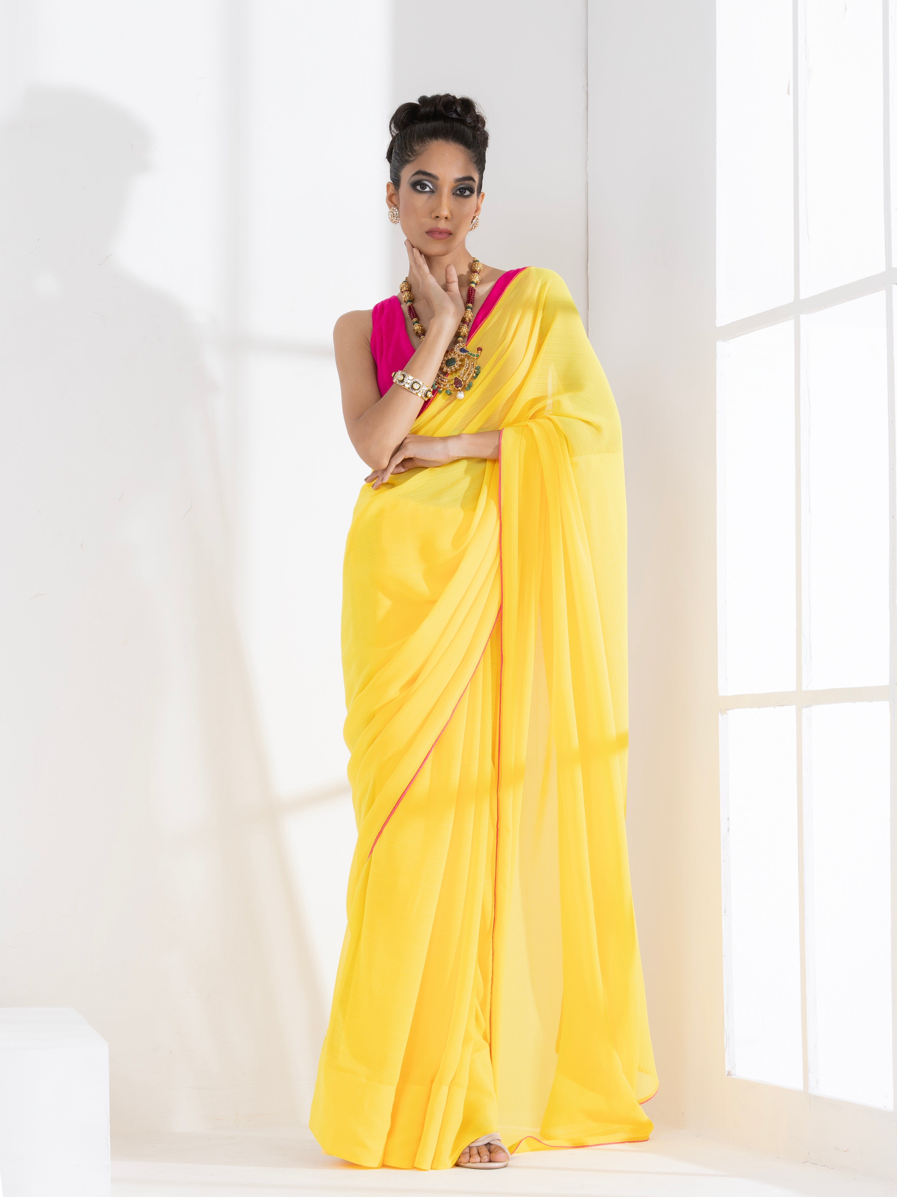 Corn Yellow Textured Chiffon Saree with Pink Piping and Fuchsia Blouse Fabric