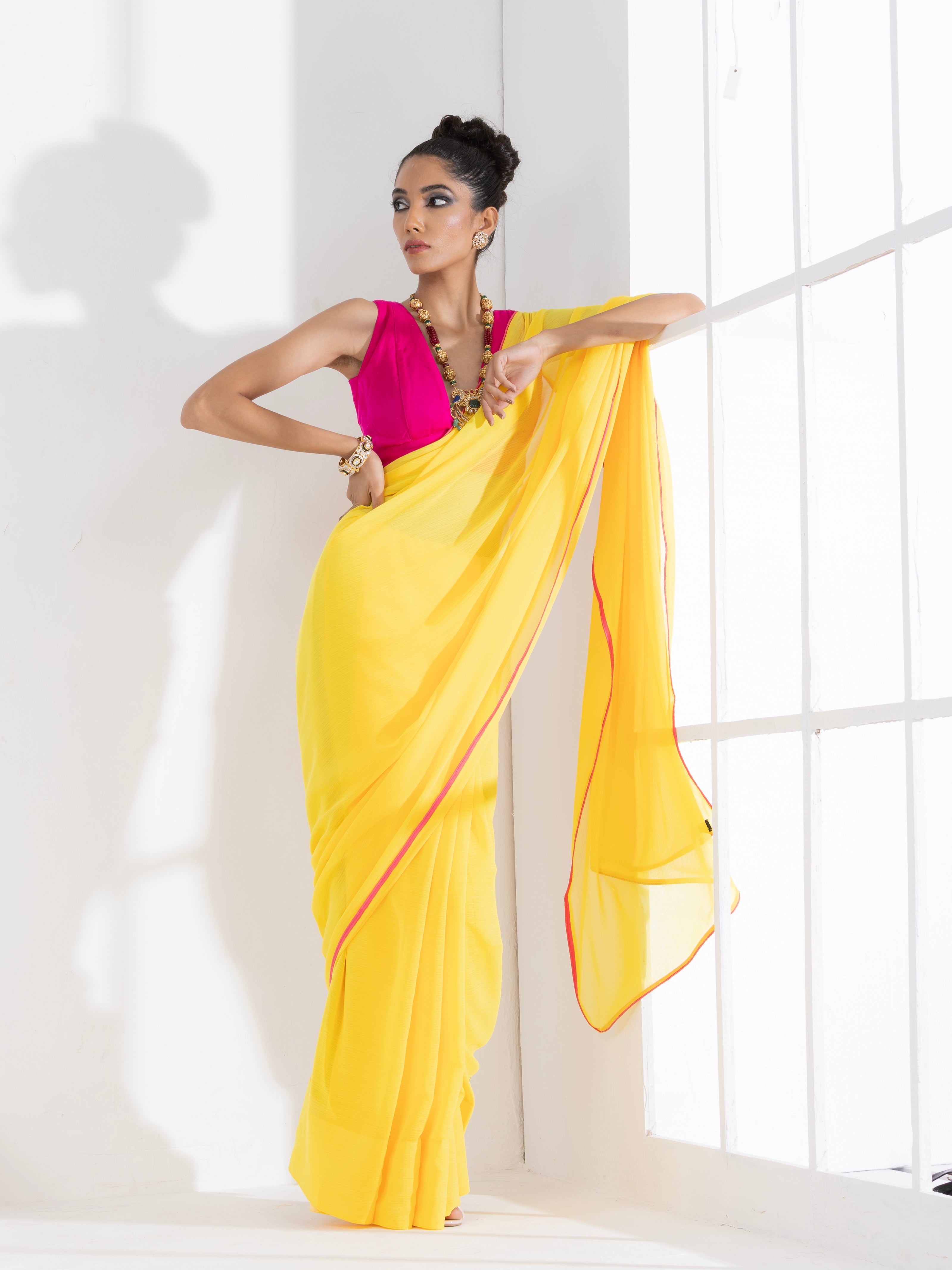 Corn Yellow Textured Chiffon Saree with Pink Piping and Fuchsia Blouse Fabric