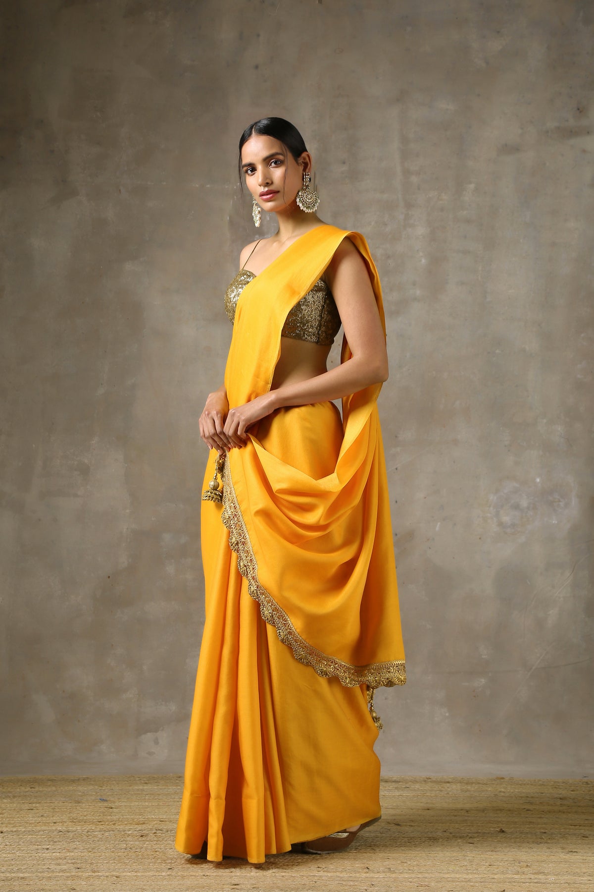 Ochre saree with handmade lace on edge with pendants — view 3